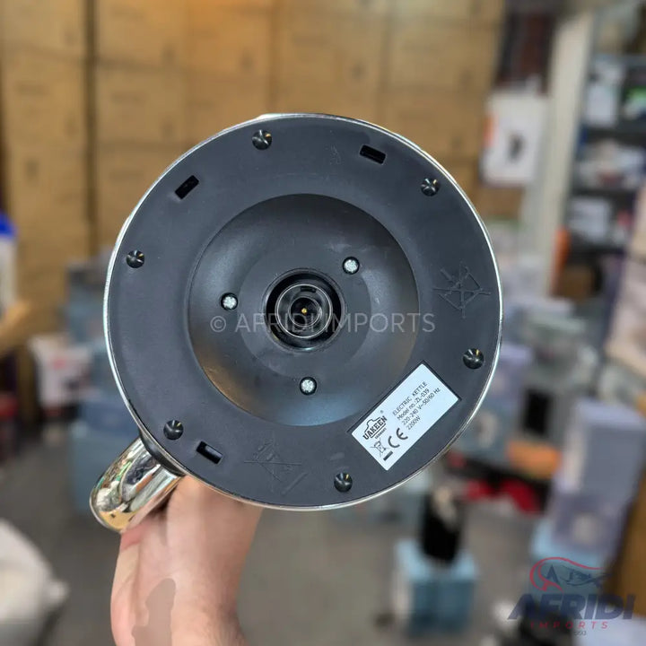 The underside of a silver electric kettle.