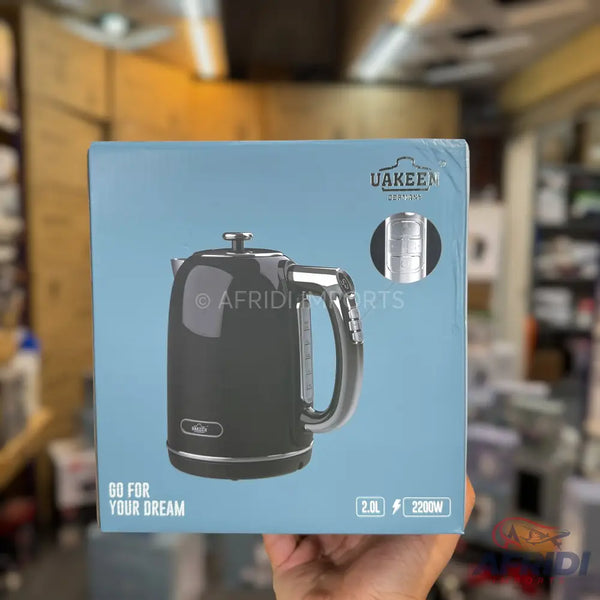 A black retro-style electric kettle with chrome accents, 2.0L capacity, and 2200W power.