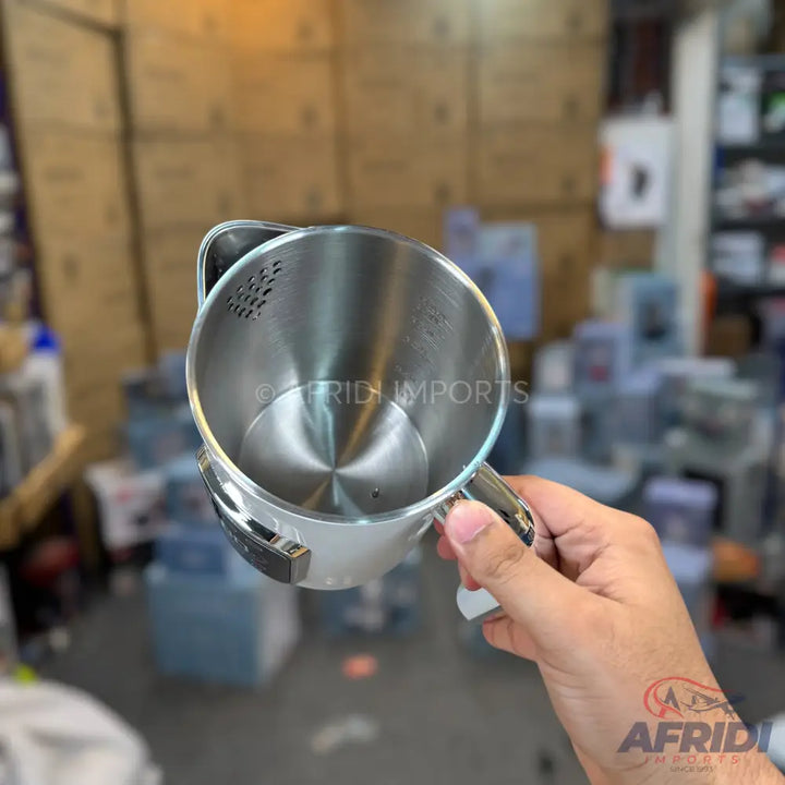 Stainless steel electric kettle with a visible heating element.