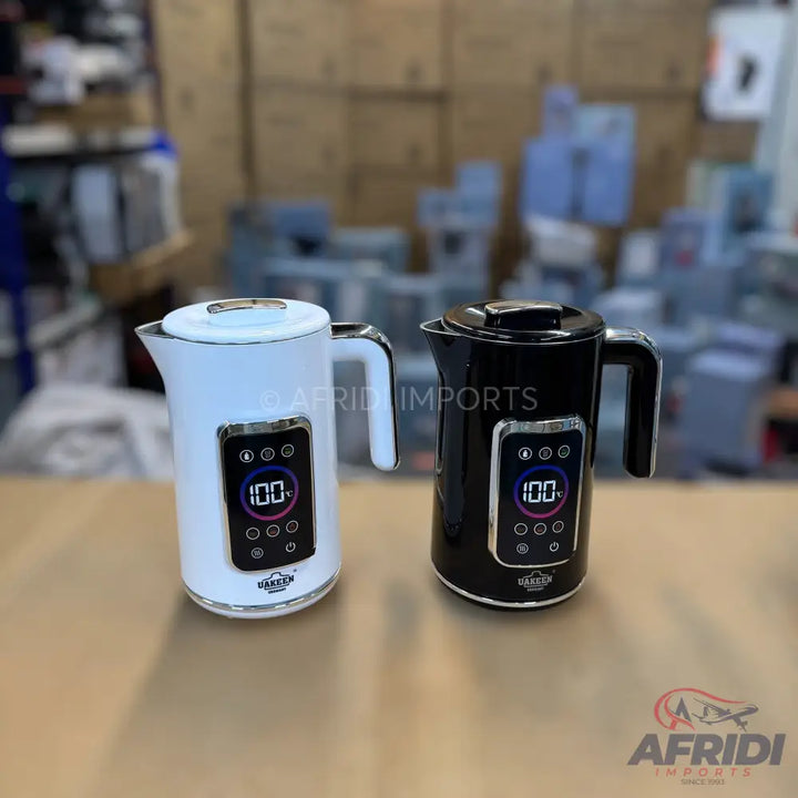 Two electric kettles, one white and one black, with digital temperature displays and control buttons.