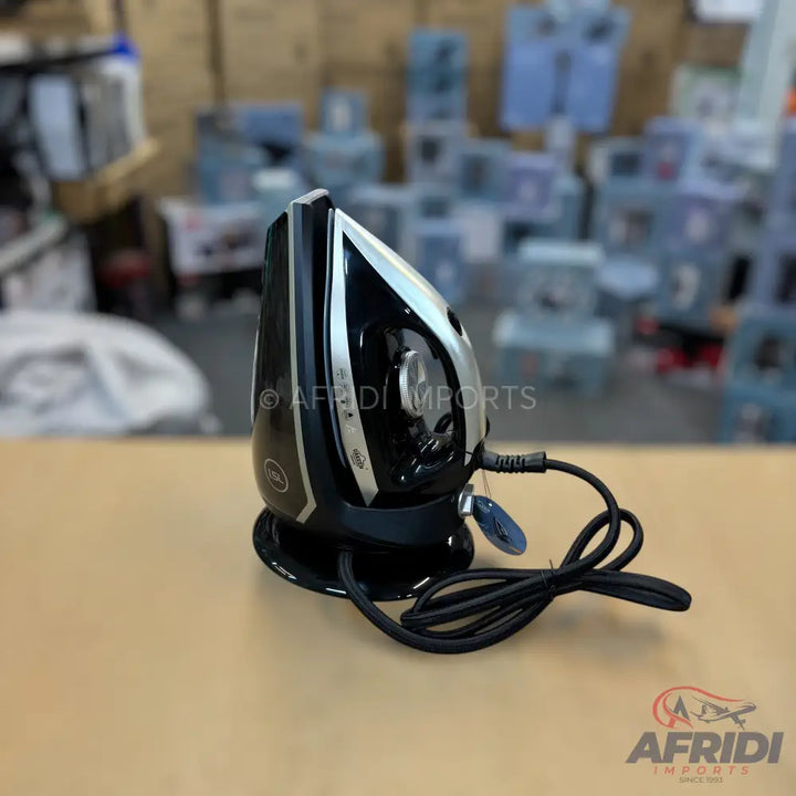 Black and silver cordless steam iron with a charging base and power cord.