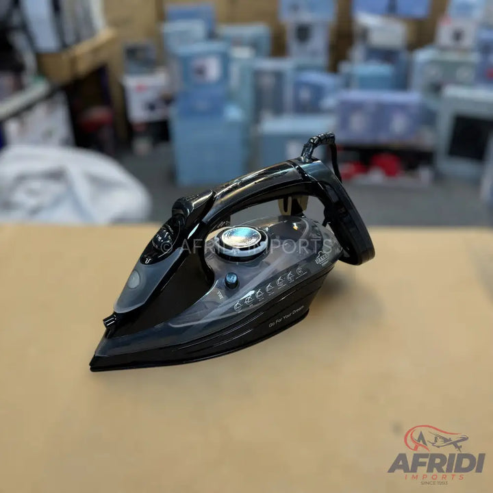 A black and clear steam iron with a temperature dial.