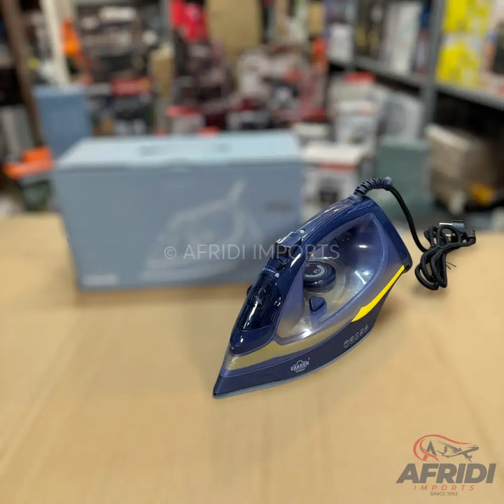A dark blue and yellow steam iron with a black power cord.
