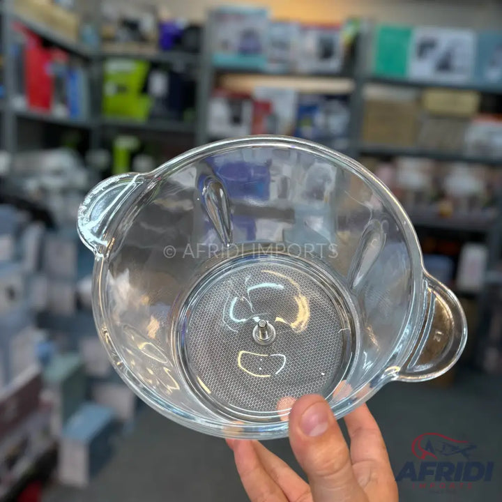 Clear glass blender jar with a built-in filter and two handles.
