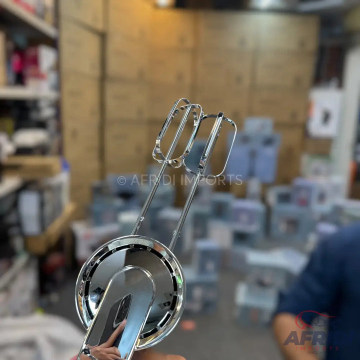 Chrome-plated electric hand mixer beaters.