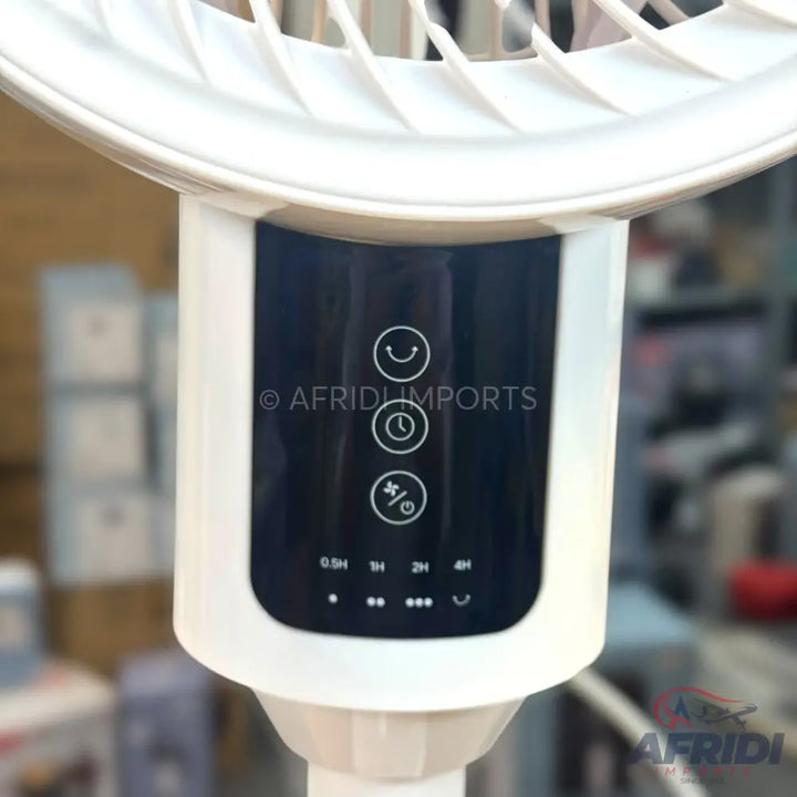 White pedestal fan with a digital control panel.