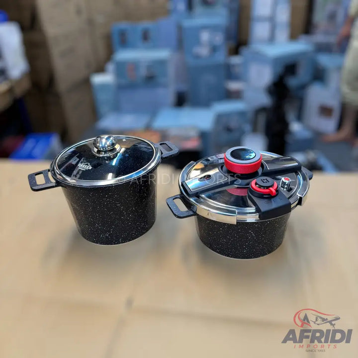 Two black speckled pots, one with a glass lid and the other a pressure cooker.