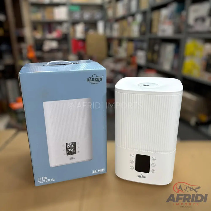 White, rectangular humidifier with a digital display and control buttons.