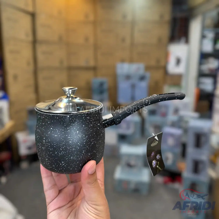 Black speckled non-stick saucepan with a metal lid and handle.