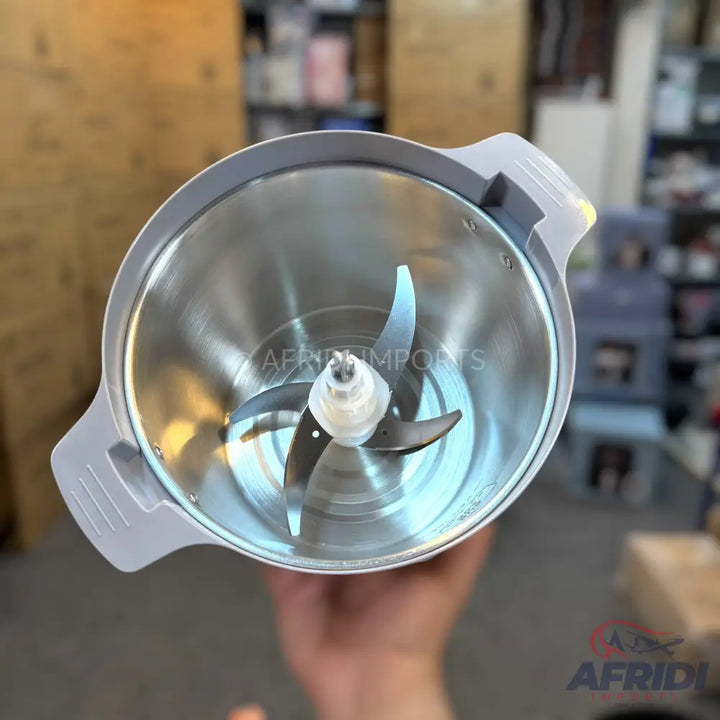 Stainless steel food chopper bowl with a four-blade assembly.
