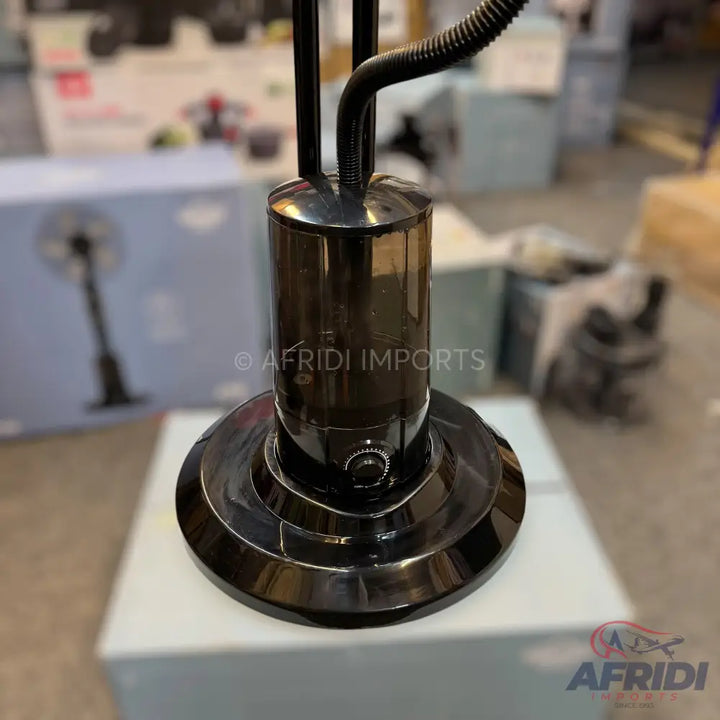 Black stand fan base with a control knob.