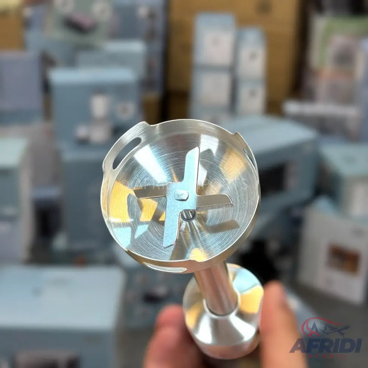 Stainless steel immersion blender head with a four-blade design.