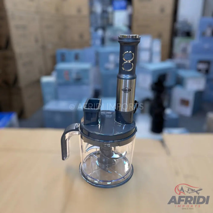 A grey and transparent food processor with a removable immersion blender attachment.
