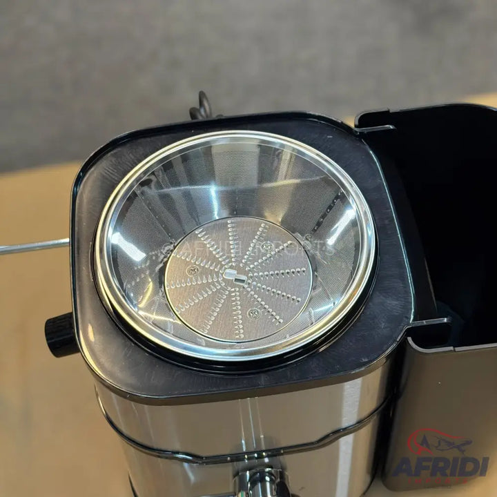 Stainless steel centrifugal juicer with a wide feed chute.