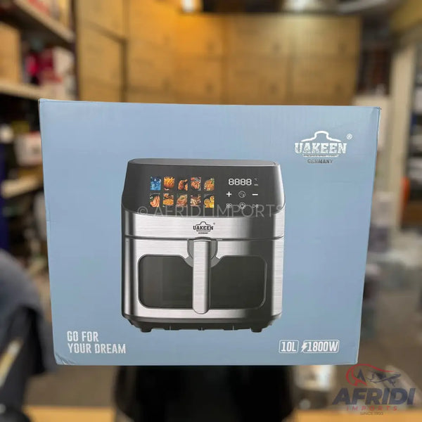 A silver and black air fryer with a digital display and a handle.
