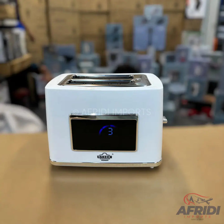 White two-slice toaster with a digital display showing ’3’’.