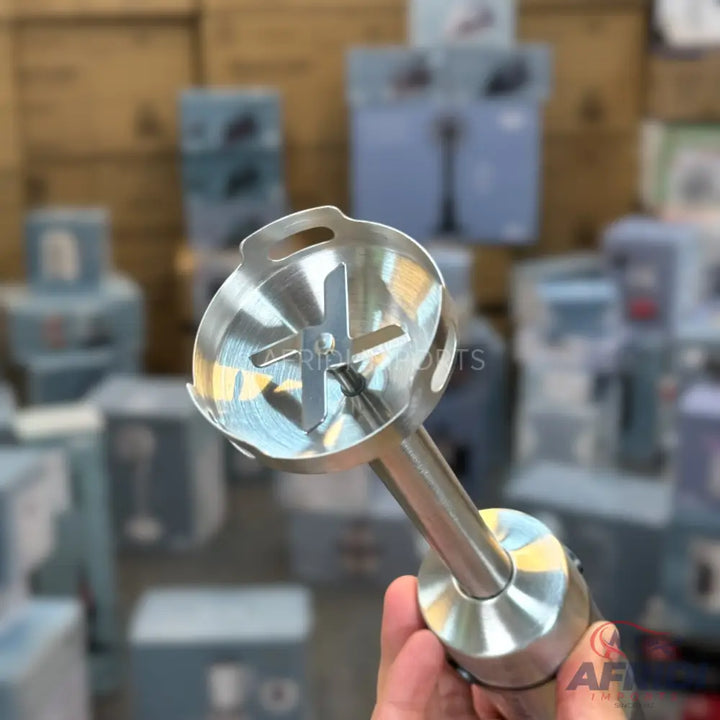 Stainless steel immersion blender attachment with a four-pronged blade.
