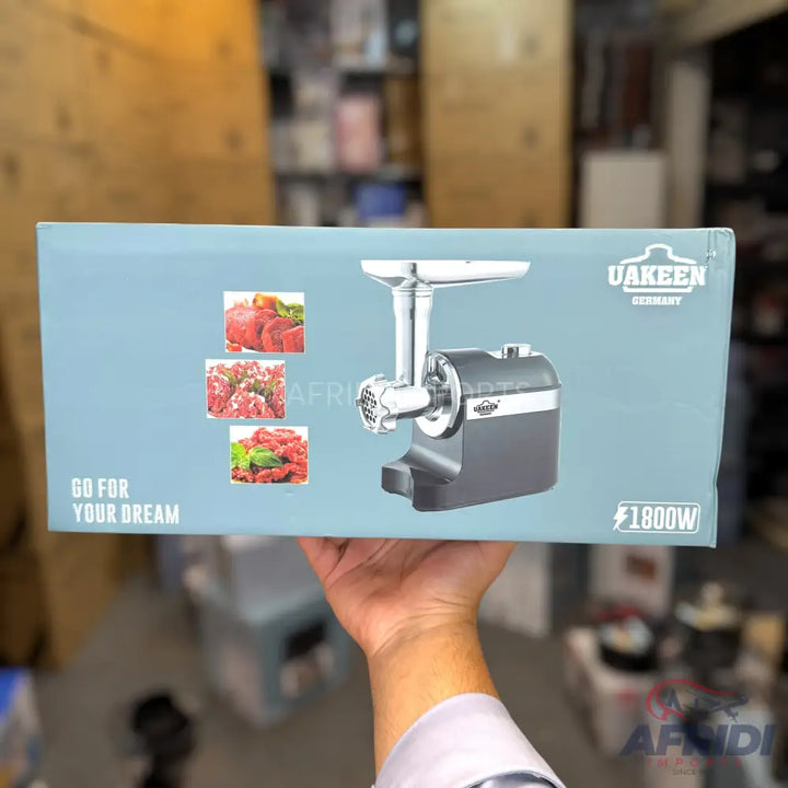 A UAKEEN Germany 1800W meat grinder.