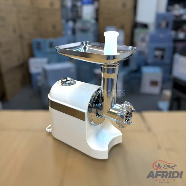 White and chrome electric meat grinder with a feeding tray and pusher.