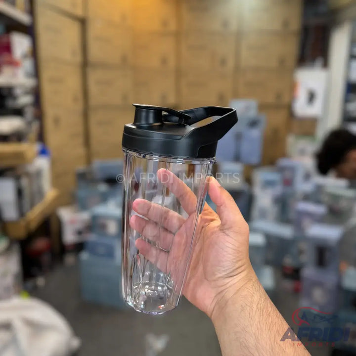 Clear plastic water bottle with a black lid and handle.