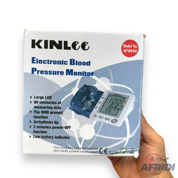 Electronic blood pressure monitor in its retail box.