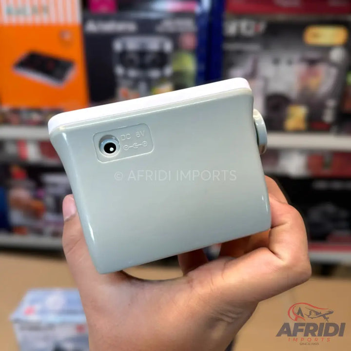 Light gray rectangular device with a DC power input port.