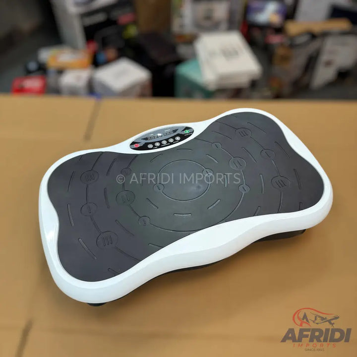 White and dark gray vibration exercise machine with a digital display.