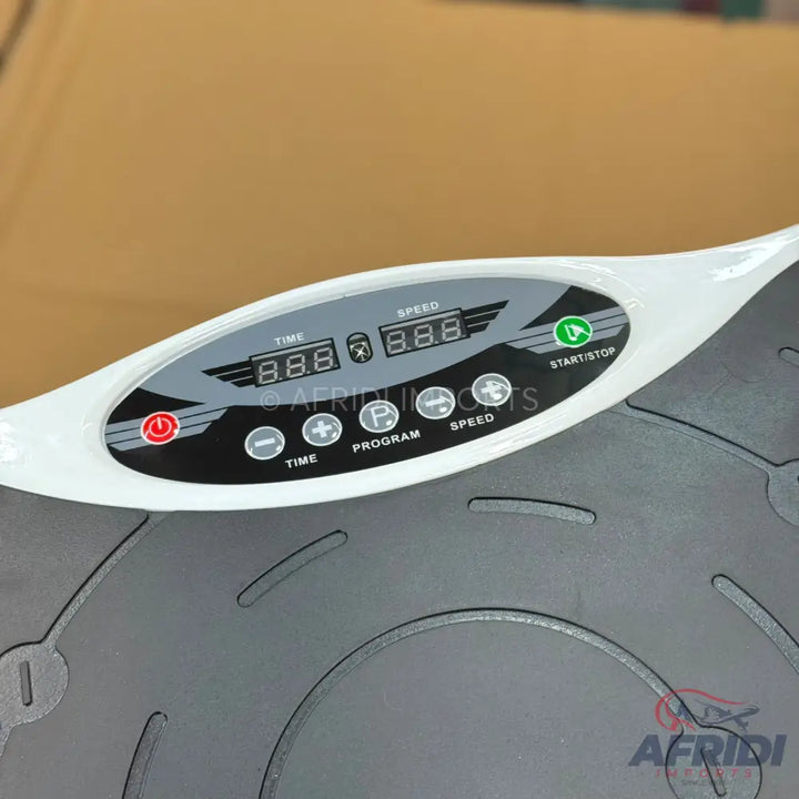 A white and gray vibration plate exercise machine with a digital display and control buttons.
