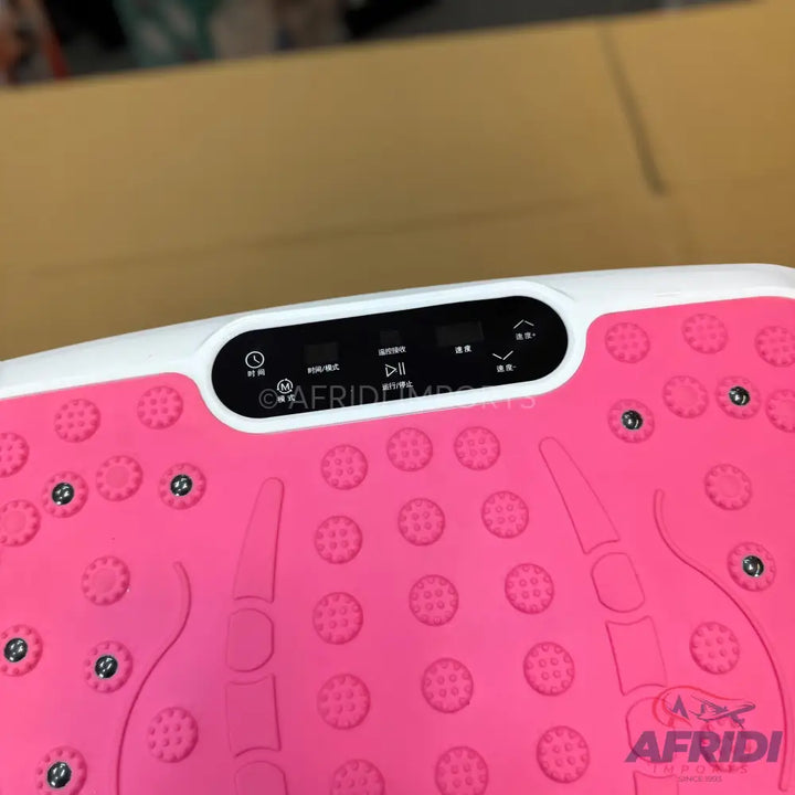Pink vibration plate with a black control panel and textured foot pads.