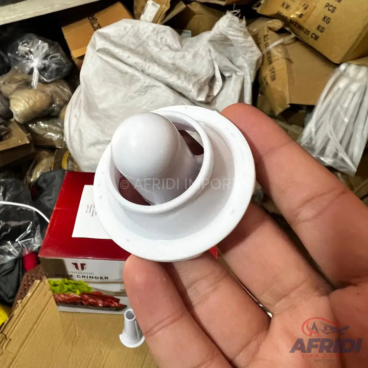 A white plastic funnel with a round, bulbous end.