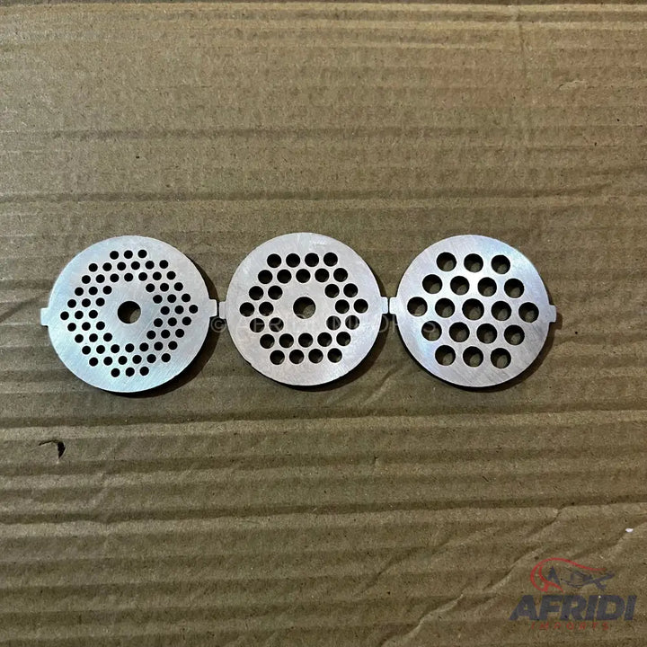 Three stainless steel meat grinder plates with varying hole sizes.