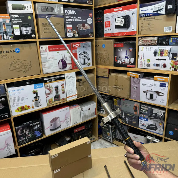 Extendable metal selfie stick with a black textured handle.
