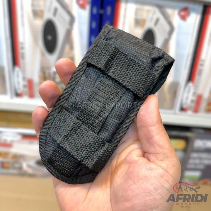 Black tactical nylon pouch with MOLLE webbing.