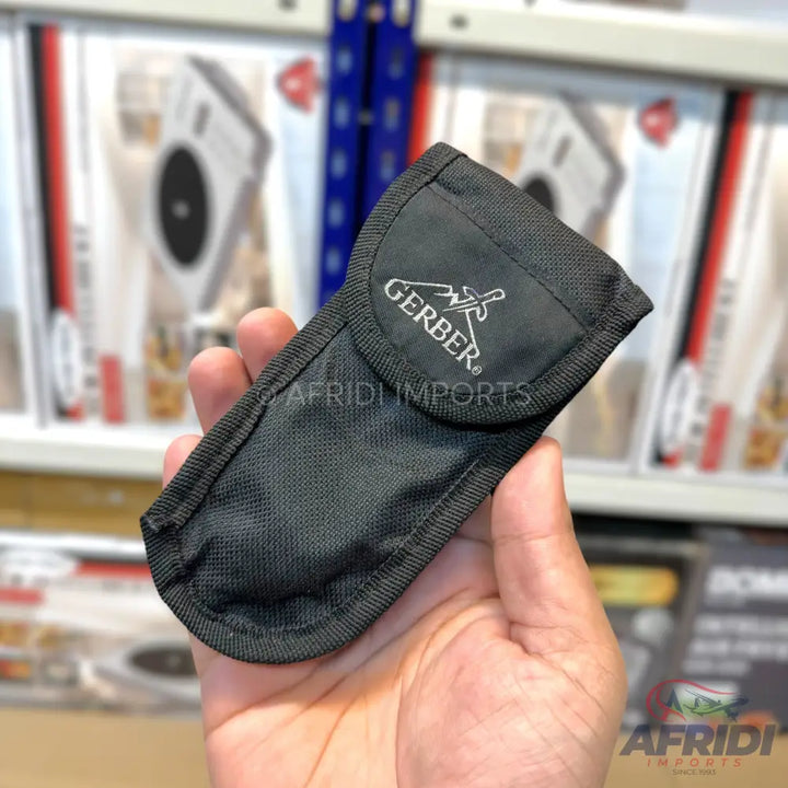 Black nylon sheath with a hook-and-loop closure for carrying a multi-tool or knife.