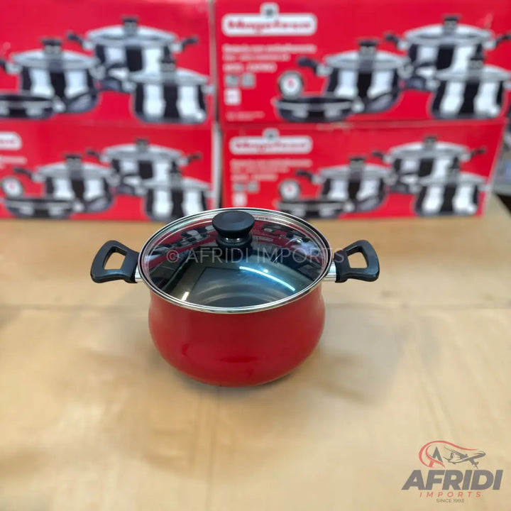 Red cooking pot with a glass lid and black handles.