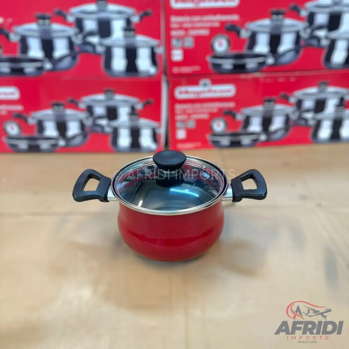 Red cooking pot with a glass lid and black handles.