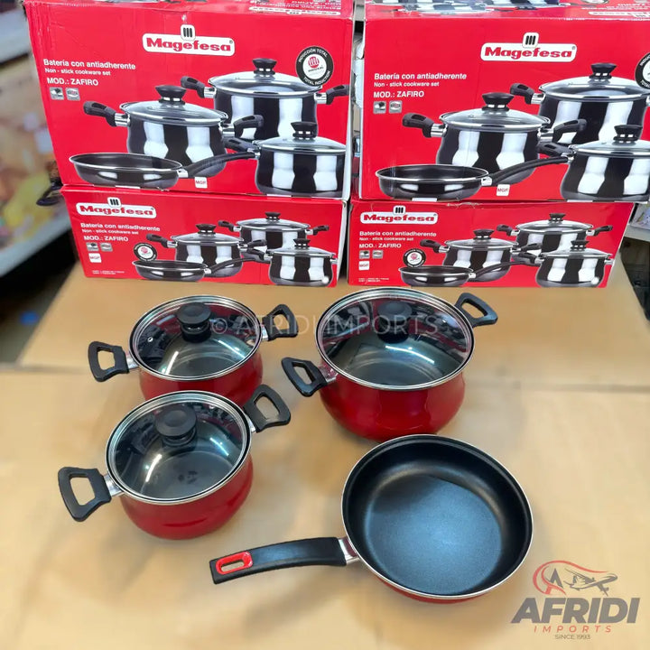 Red and black cookware set with glass lids.