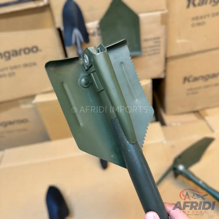 Olive green folding shovel with a serrated edge.