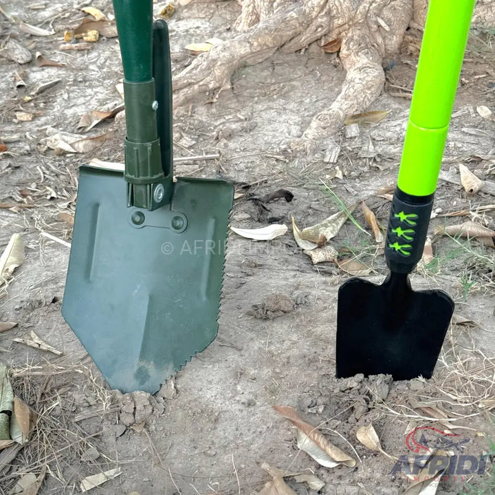 Two digging shovels, one folding and one fixed, with green handles.