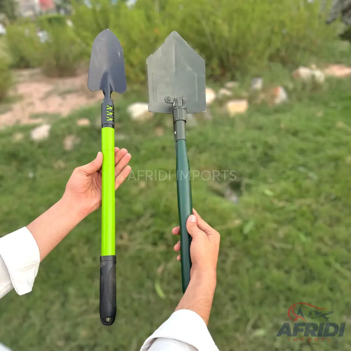 Two portable, collapsible shovels for outdoor use.
