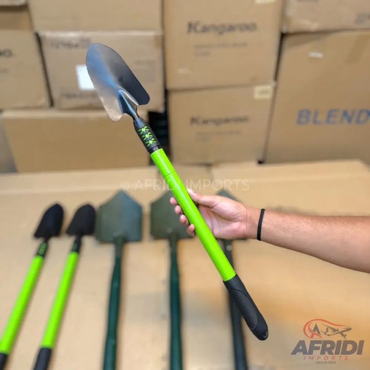 A small garden shovel with a bright green handle and a black grip.