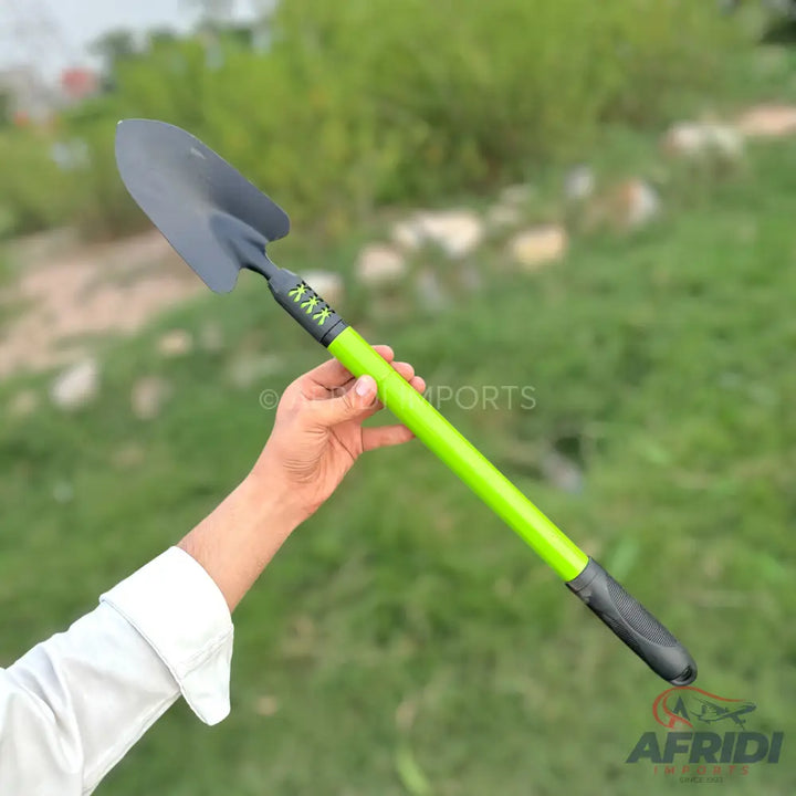 A gardening shovel with a black head and a bright green handle.