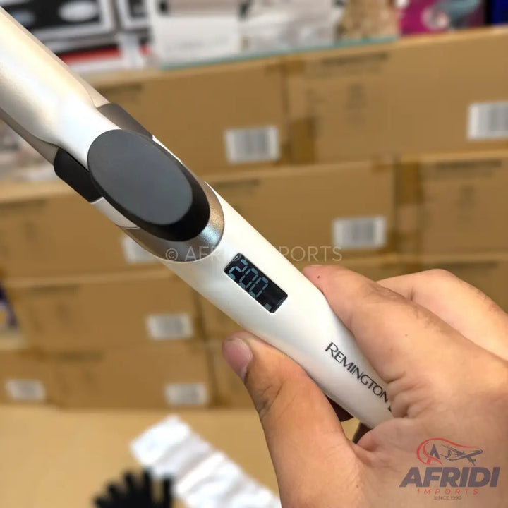 A white hair curling iron with a digital temperature display set to 200 degrees.