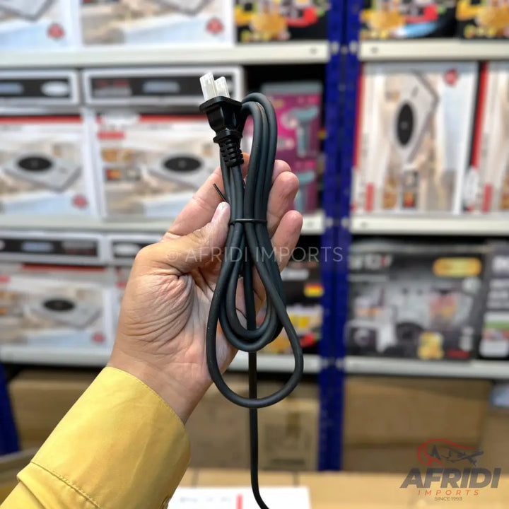 A black power cord with a Type G (BS 1363) plug.