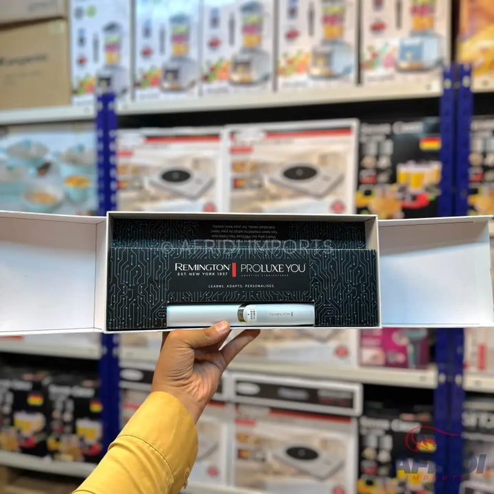 A Remington Proluxe You hair styling tool set in an open box.