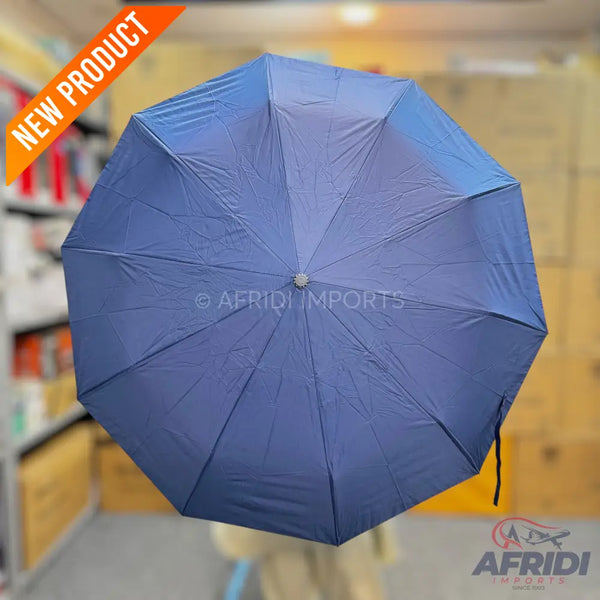 A dark blue, octagonal umbrella with a silver tip.