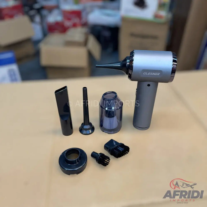 A portable, rechargeable air duster and vacuum cleaner with various nozzle attachments.
