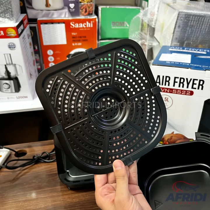 A black air fryer basket with a perforated design and a removable base.