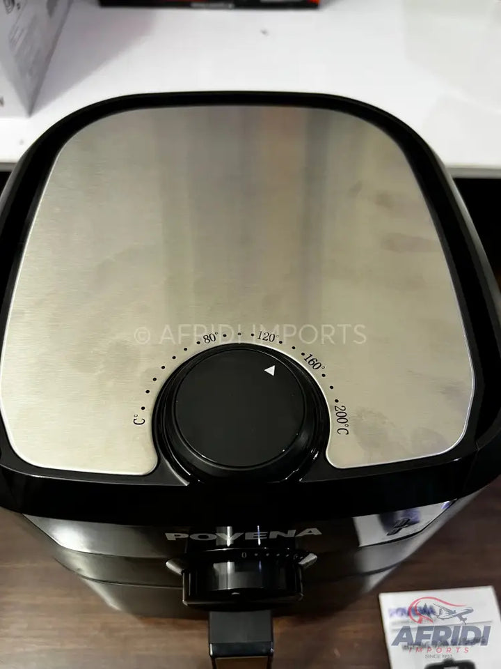 Black and silver air fryer with a temperature dial.
