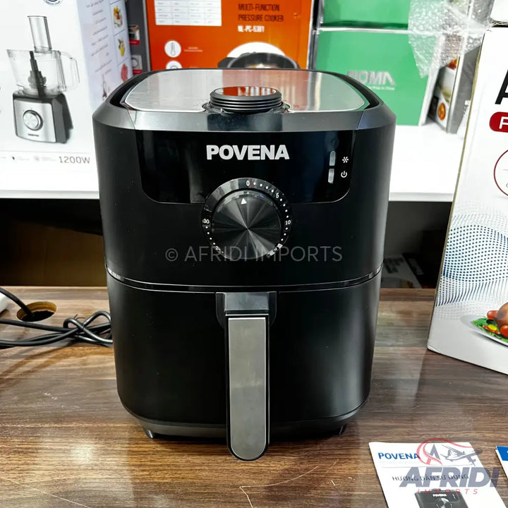 Black digital air fryer with a silver handle and top.